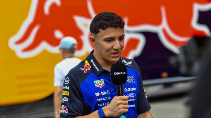 Isack Hadjar interviewed by Canal+ in front of the Red Bull hospitality