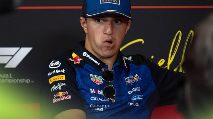 Isack Hadjar pulls a face as he looks on in a press conference. F1 news