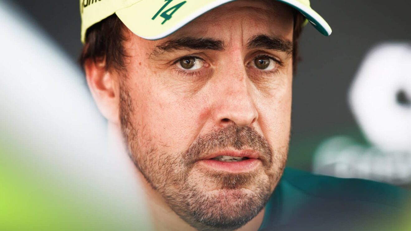 Fernando Alonso eyes the camera as he speaks to the media
