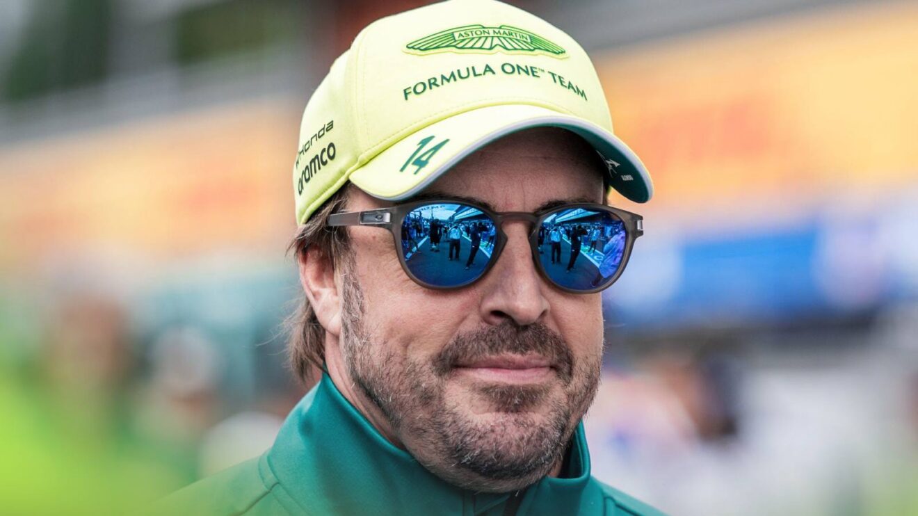 Fernando Alonso walks through the Belgian GP paddock.