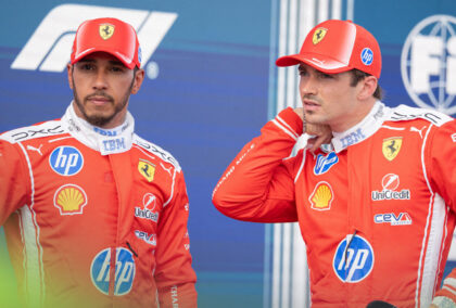 Lewis Hamilton and Charles Leclerc in their Ferrari overalls.