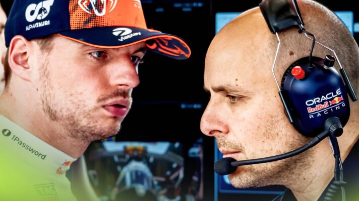 Max Verstappen looks at GianPiero Lambiase in the Red Bull garage