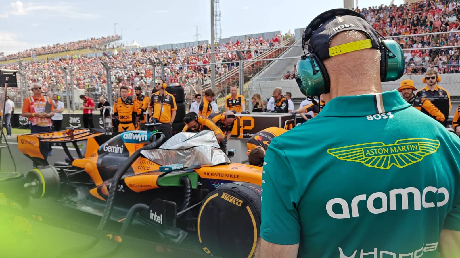 A behind-view shot of Adrian Newey looking at the McLaren MCL40 on the grid in Hungary