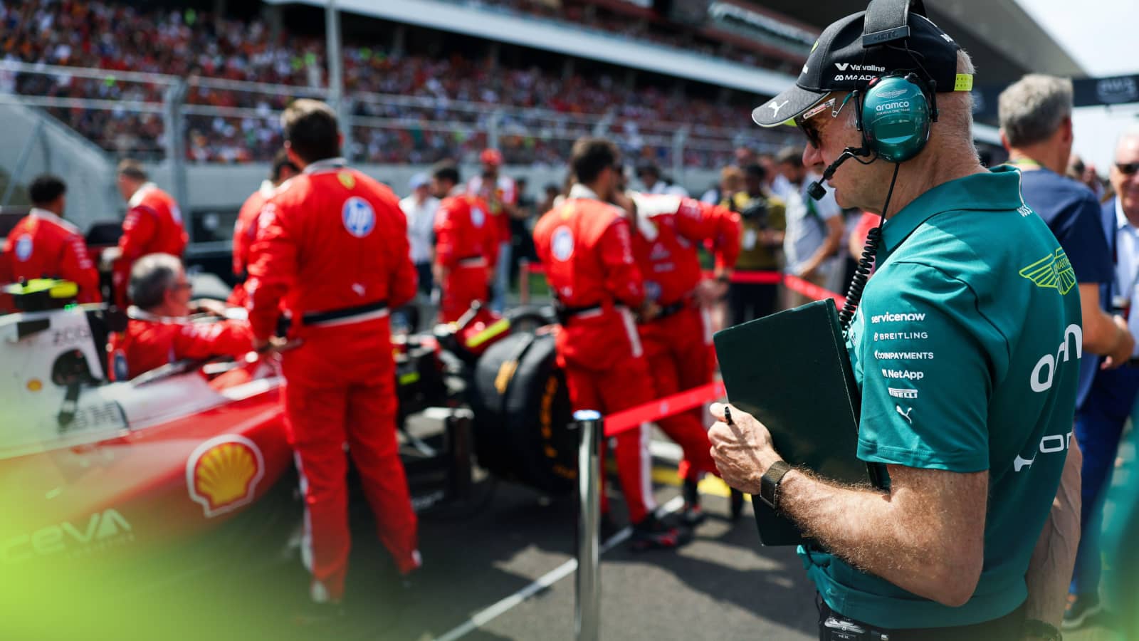 Adrian Newey stood examining Lewis Hamilton's Ferrari on the grid in Budapest