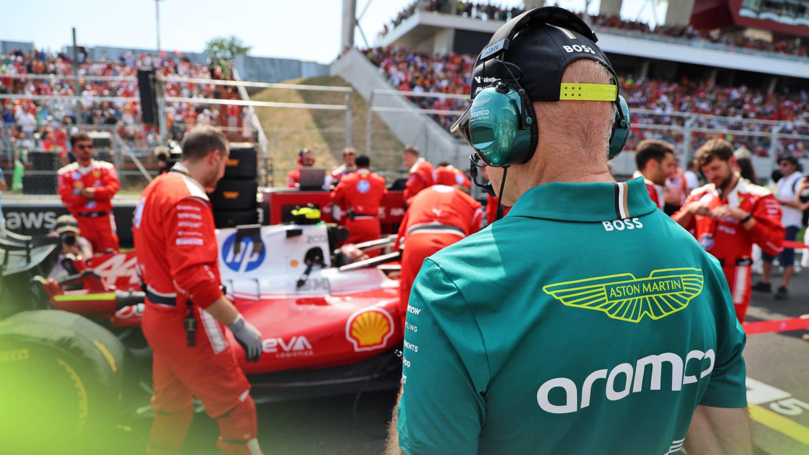 An over-the-shoulder shot of Adrian Newey examining Lewis Hamilton's Ferrari on the grid in Budapest
