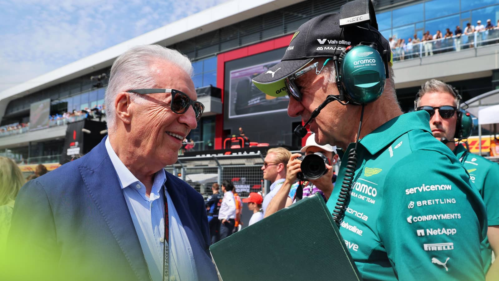 Piero Ferrari and Adrian Newey in conversation on the grid in Budapest