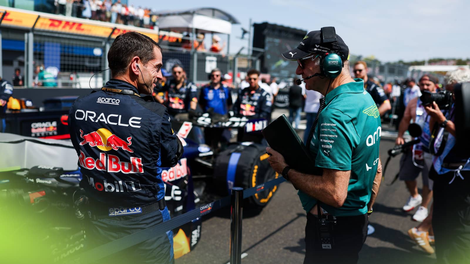 Adrian Newey in conversation with a Red Bull mechanic on the grid in Budapest
