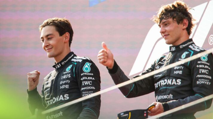 Mercedes drivers George Russell and Kimi Antonelli stand on the Austrian Grand Prix podium.