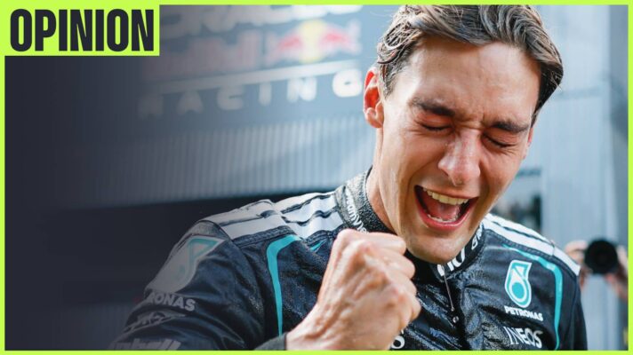 George Russell with his eyes closed as he punches the air in celebration with an 'opinion' tab in the top-left corner