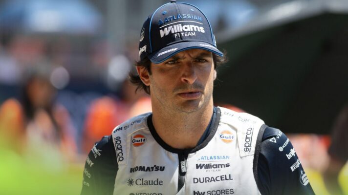 Carlos Sainz looks in the distance on the grid in Austria.