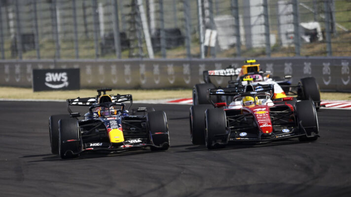 Max Verstappen overtaking Lewis Hamilton and Liam Lawson in one move into Turn 1 in Hungary