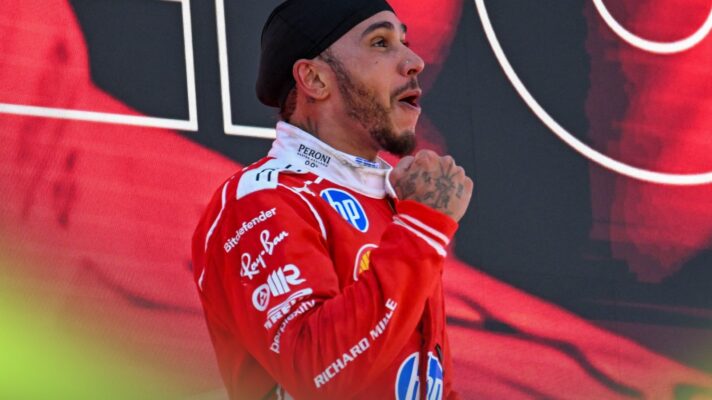 Ferrari driver Lewis Hamilton celebrates victory on the podium at the 2026 Barcelona-Catalunya Grand Prix