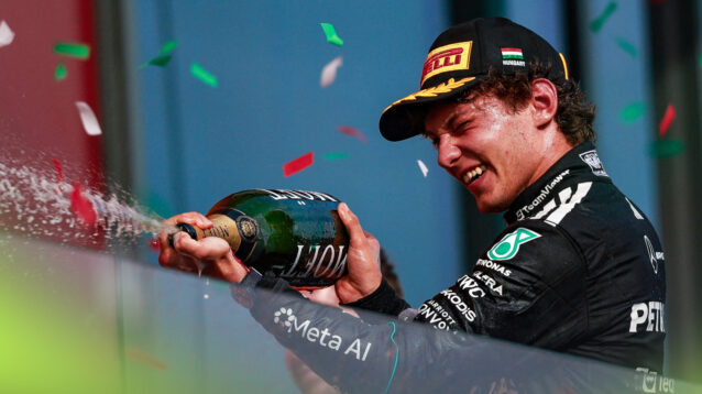 Mercedes driver Kimi Antonelli celebrates on the podium.