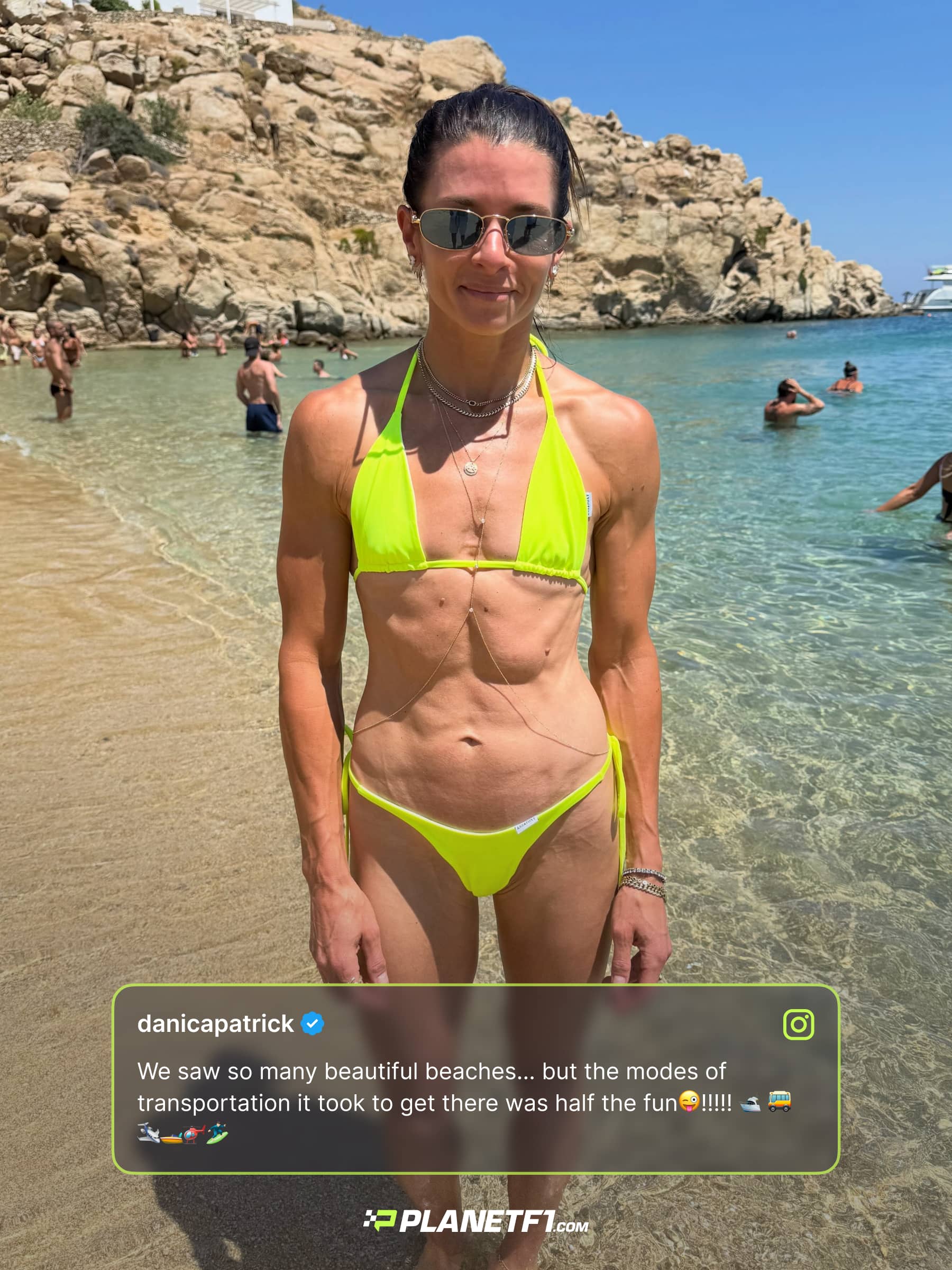 Danica Patrick posing on a beach in a yellow bikini