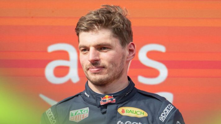 Max Verstappen looks on during the podium celebrations