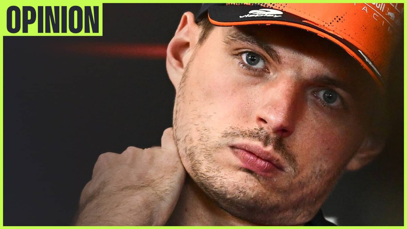 Max Verstappen tilts his head in a press conference while holding his hand to his neck. An 'opinion' tab is in the top-left corner