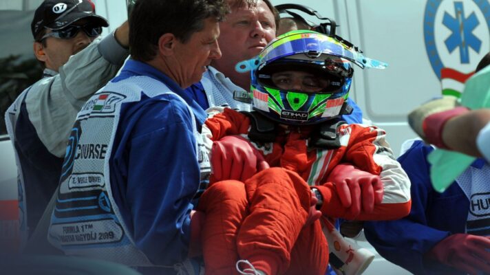 Felipe Massa, Ferrari, is lifted from his car after a serious 2009 Hungarian Grand Prix crash