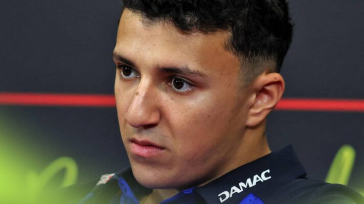 A close-up shot of Isack Hadjar in a press conference