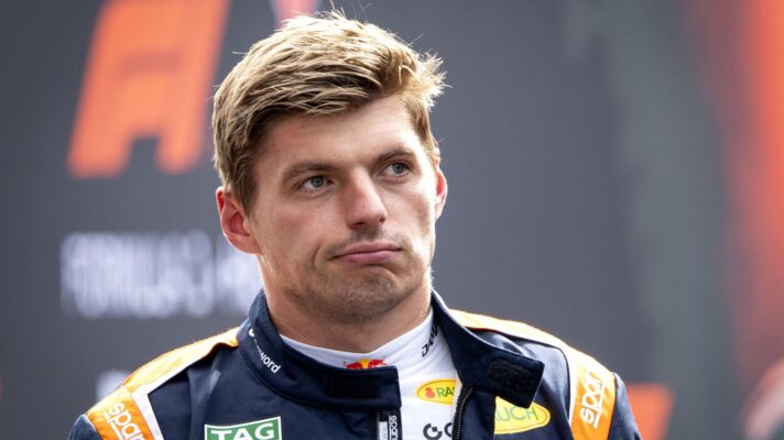 Max Verstappen pulls a face as he walks back to the paddock