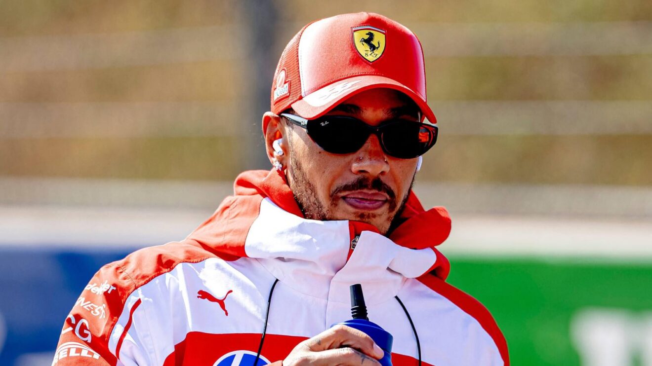 Ferrari driver Lewis Hamilton wearing sunglasses on a track walk at Zandvoort.