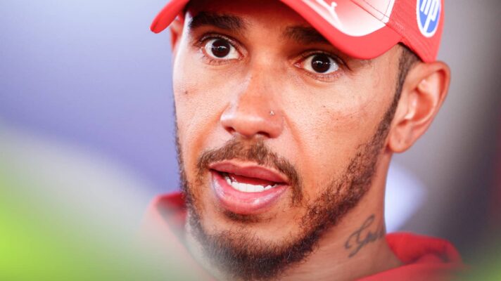A close-up shot of Lewis Hamilton speaking to the media