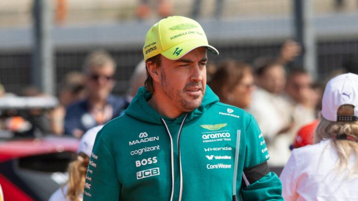 Fernando Alonso walks on the grid before the race.