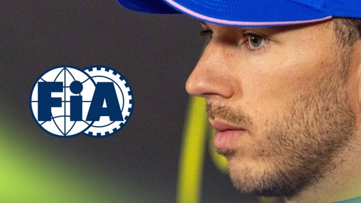 A side-profile shot of Pierre Gasly in a press conference with a prominent FIA logo alongside him