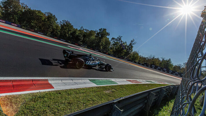 George Russell running at a sunny Monza circuit