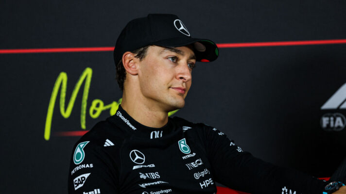 George Russell head cocked to the side in a press conference