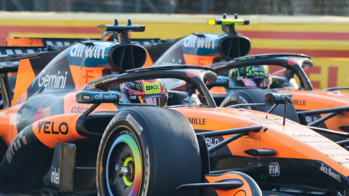 Oscar Piastri and Lando Norris racing wheel to wheel at Monza