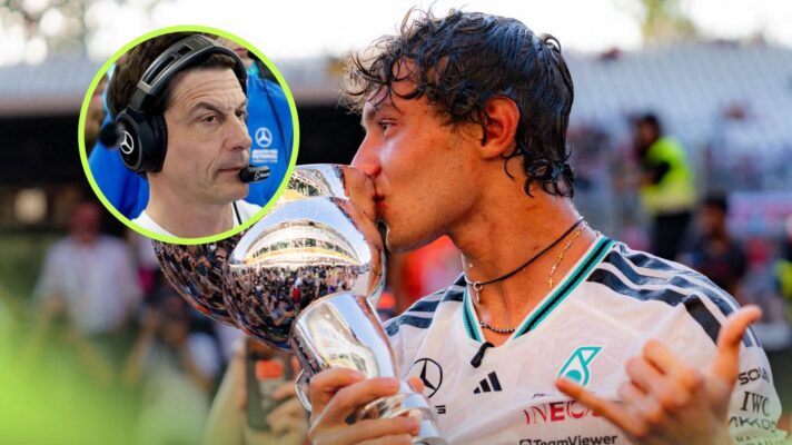 Kimi Antonelli holds his Monza trophy with Toto Wolff inset.