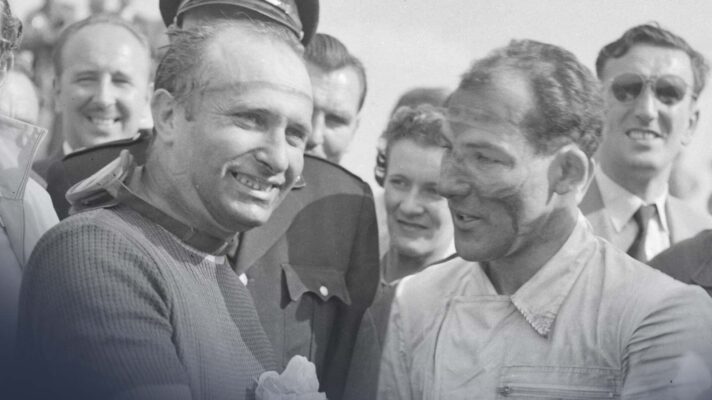 Juan Manuel Fangio, left, stands with Stirling Moss, right.