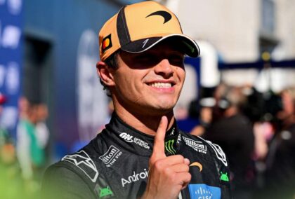 Lando Norris holds one finger up in celebration of his pole position at the Spanish Grand Prix.