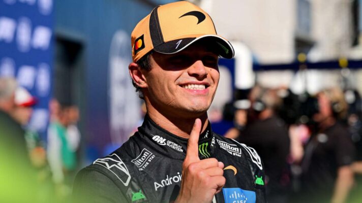 Lando Norris holds one finger up in celebration of his pole position at the Spanish Grand Prix.