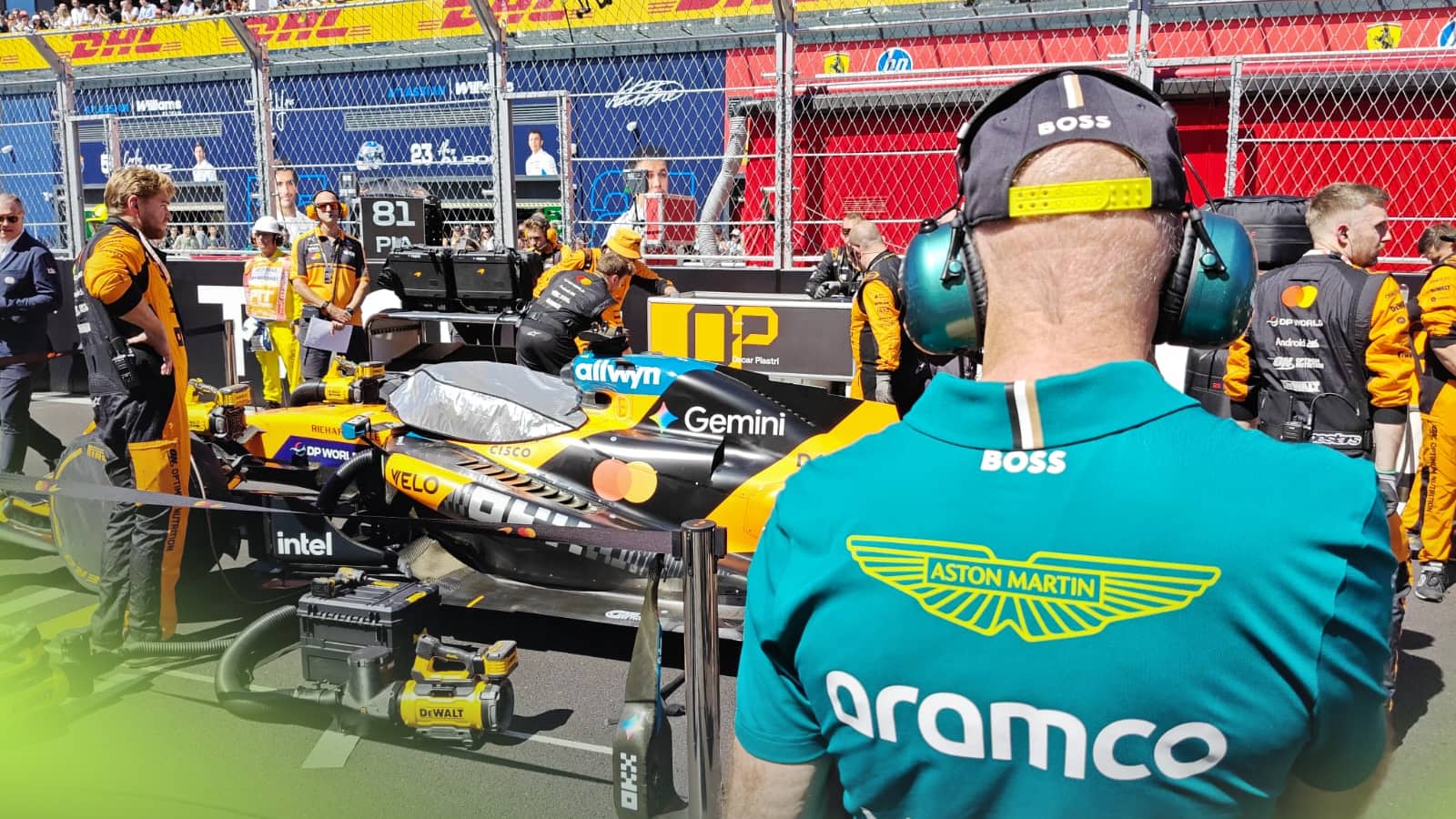An over-the-shoulder shot of Adrian Newey looking at the McLaren MCL40 on the grid in Madrid