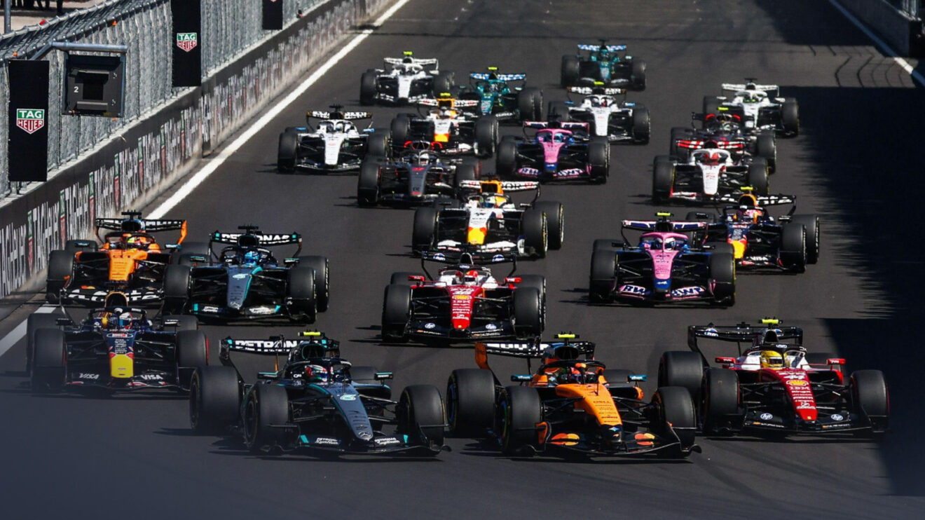 The F1 pack races towards Turn 1 at the start of the 2026 Spanish Grand Prix.