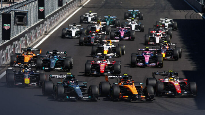 The F1 pack races towards Turn 1 at the start of the 2026 Spanish Grand Prix.