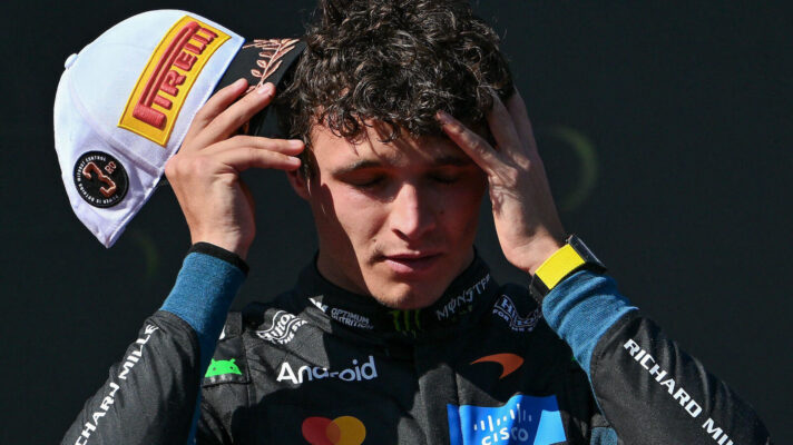 Lando Norris puts his hands to his head after losing a potential win at the Madring