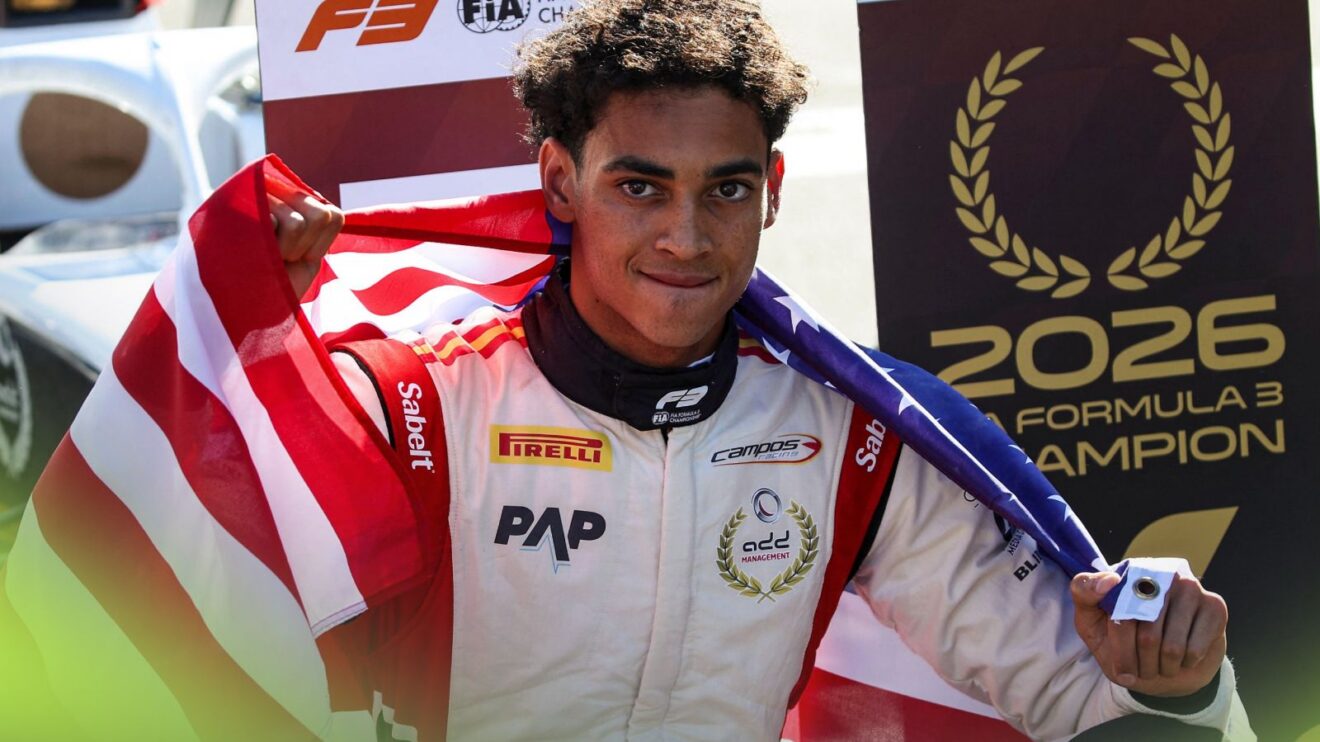 Ugo Ugochukwu poses with the American flag after winning the 2026 Formula 3 title in Madrid