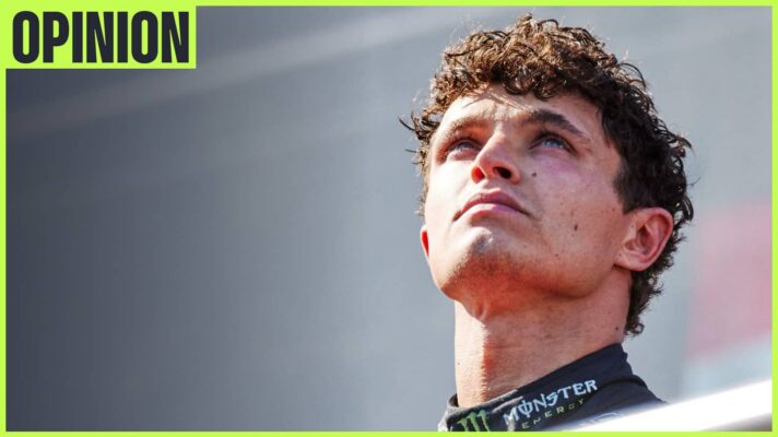 Lando Norris looks to the sky during the podium celebrations with an 'opinion' tab in the top-left corner