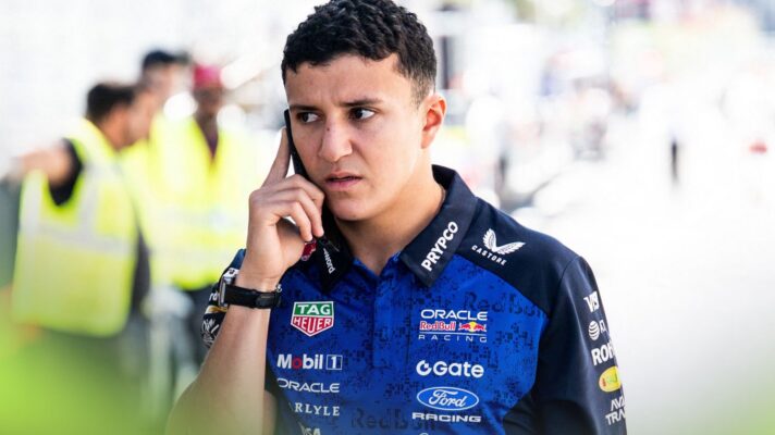 Isack Hadjar, Red Bull, speaking on the phone at the 2026 Spanish Grand Prix