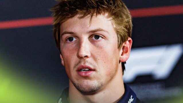 Liam Lawson looks on in a press conference