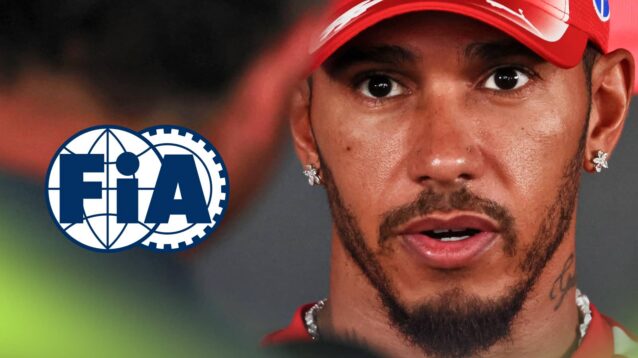 Lewis Hamilton speaks to the media with a prominent FIA logo alongside him