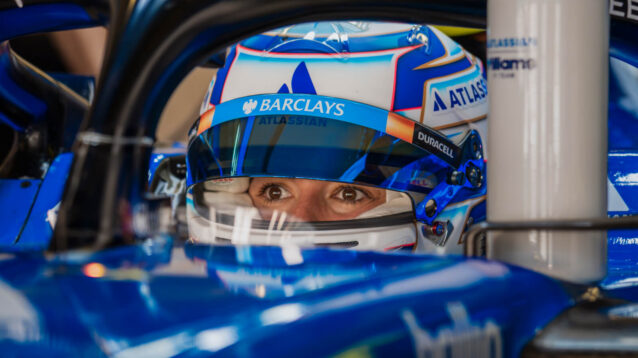 Jamie Chadwick eyes in helmet sitting in the Williams FW47