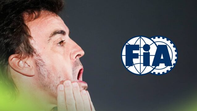 A side-profile shot of Fernando Alonso with his mouth open wide and his hands held to his face with a prominent FIA logo alongside him