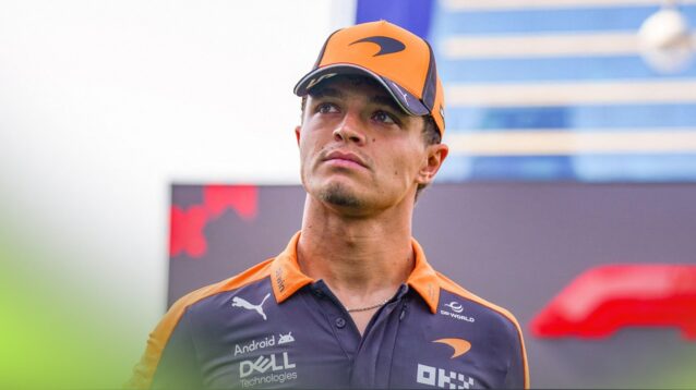Lando Norris walks through the F1 paddock at the Azerbaijan GP in Baku.