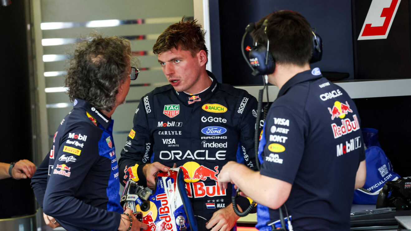 Max Verstappen speaking with Laurent Mekies in the Red Bull garage