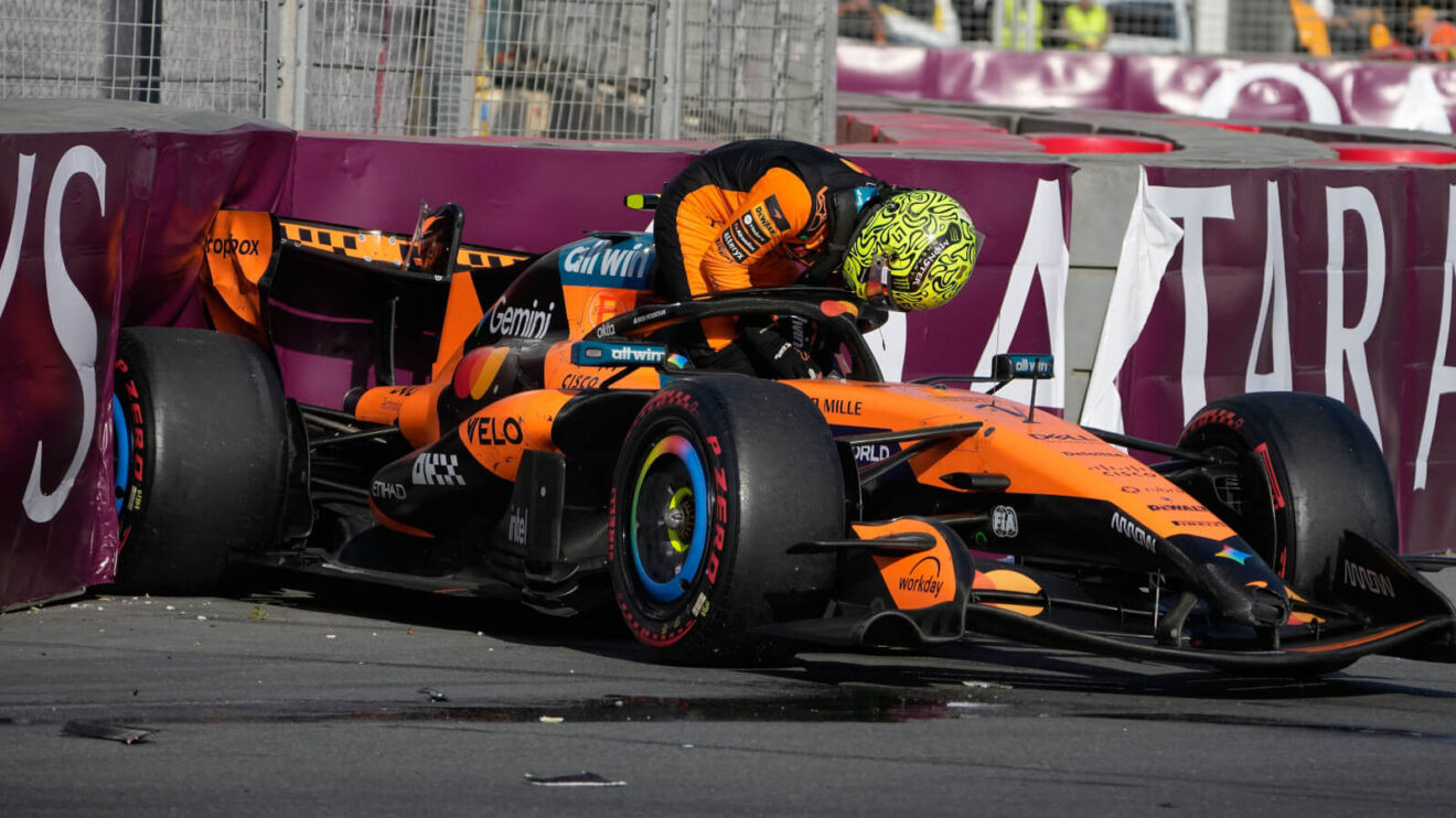 Lando Norris climbs out of his McLaren in Baku, his MCL40 in the barrier