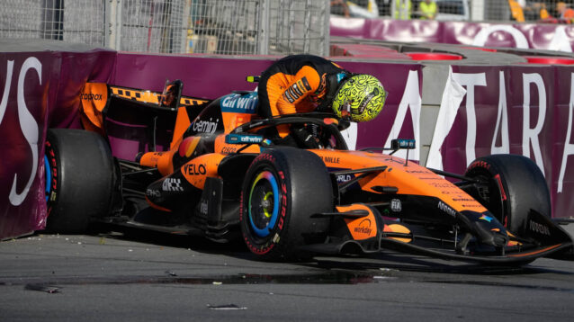 Lando Norris climbs out of his McLaren in Baku, his MCL40 in the barrier