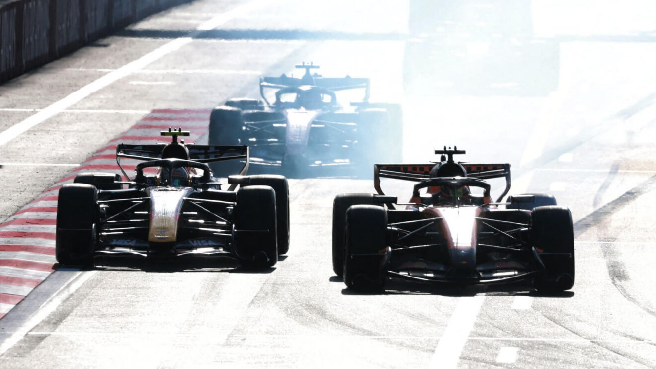 Oscar Piastri tyre smoke as he locked up defending against Red Bull in Baku
